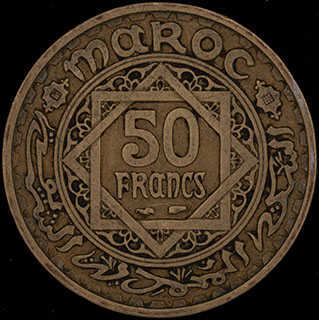 Марокко. 50 франков 1371 (1952) г. Медно-алюминиево-никелевый сплав Марокко. 50 франков 1371 (1952) г. Медно-алюминиево-никелевый сплав
